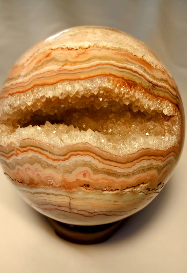 Crazy Lace Agate Sphere with Large Druzy Pocket