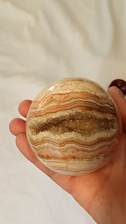 Crazy Lace Agate Sphere with Large Druzy Pocket